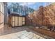 Tiled patio surrounded by a brick wall and detached shed at 2 Westchester Sq, Decatur, GA 30030