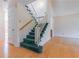 Staircase featuring wood and carpet steps with white banister, leading to other levels of the home at 2 Westchester Sq, Decatur, GA 30030