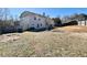 Expansive backyard partially fenced, ideal for Gathering gatherings and outdoor recreation and play equipment at 1399 Dukes Creek Nw Dr, Kennesaw, GA 30152