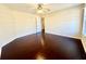 Bright bedroom featuring hardwood floors and a ceiling fan at 1399 Dukes Creek Nw Dr, Kennesaw, GA 30152