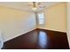 Cozy bedroom featuring hardwood floors and natural light at 1399 Dukes Creek Nw Dr, Kennesaw, GA 30152