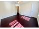 Bedroom with hardwood floors, fan, and natural light at 1399 Dukes Creek Nw Dr, Kennesaw, GA 30152