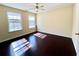 Bedroom view showing hardwood floors and a ceiling fan at 1399 Dukes Creek Nw Dr, Kennesaw, GA 30152