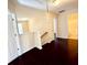 Hallway with hardwood floors and neutral-colored walls at 1399 Dukes Creek Nw Dr, Kennesaw, GA 30152