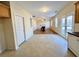 Spacious living room visible from the kitchen, featuring a fireplace and wood floors at 1399 Dukes Creek Nw Dr, Kennesaw, GA 30152