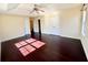 Light filled main bedroom boasts a ceiling fan, trey ceiling, and hardwood floors at 1399 Dukes Creek Nw Dr, Kennesaw, GA 30152