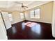 Light filled main bedroom boasts a ceiling fan, trey ceiling, and hardwood floors at 1399 Dukes Creek Nw Dr, Kennesaw, GA 30152