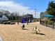 Community playground with swings, slides, and play structures for children and families to enjoy at 1399 Dukes Creek Nw Dr, Kennesaw, GA 30152