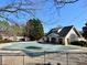 Community pool with a covered surface and fenced perimeter, ensuring safety and privacy for residents at 1399 Dukes Creek Nw Dr, Kennesaw, GA 30152