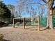 Community swing set area adjacent to tennis courts offering recreation and leisure for residents at 1399 Dukes Creek Nw Dr, Kennesaw, GA 30152