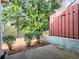 An inviting backyard shows a wood fence, mature shade tree and tidy landscaping at 2357 Barrett Cottage Pl, Marietta, GA 30066