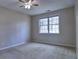 Neutral bedroom with a large window providing natural light at 2357 Barrett Cottage Pl, Marietta, GA 30066