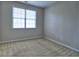 Bedroom with a large window and neutral carpet at 2357 Barrett Cottage Pl, Marietta, GA 30066