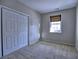 Bedroom with large closet and a window providing natural light at 2357 Barrett Cottage Pl, Marietta, GA 30066