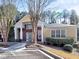 Charming clubhouse featuring a brick facade, columns, and manicured landscaping at 2357 Barrett Cottage Pl, Marietta, GA 30066