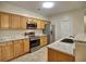 Bright kitchen featuring stainless steel appliances and granite countertops at 2357 Barrett Cottage Pl, Marietta, GA 30066
