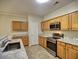 Well-lit kitchen with stainless steel appliances and light wood cabinets at 2357 Barrett Cottage Pl, Marietta, GA 30066