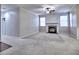 Spacious living room with fireplace, carpet, neutral walls and trim providing a cozy and inviting atmosphere at 2357 Barrett Cottage Pl, Marietta, GA 30066
