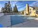 A fenced pool with an enclosed cover in the backyard of a yellow house at 2357 Barrett Cottage Pl, Marietta, GA 30066