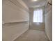 Spacious walk-in closet with shelving for ample storage at 2357 Barrett Cottage Pl, Marietta, GA 30066