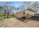 Backyard features a wooden deck off the brick two-story home at 304 Mercer Dr, Jonesboro, GA 30236
