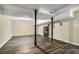 Unfinished basement featuring an exposed ceiling, dark flooring, and a water heater at 304 Mercer Dr, Jonesboro, GA 30236