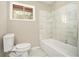 Bathroom featuring tiled bathtub and shower at 304 Mercer Dr, Jonesboro, GA 30236
