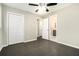 A spacious bedroom with a closet, a ceiling fan, and an ensuite bathroom at 304 Mercer Dr, Jonesboro, GA 30236