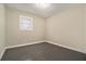 Bedroom features neutral paint, one window, and modern floors at 304 Mercer Dr, Jonesboro, GA 30236