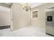 Charming dining area featuring tile floors, stainless steel appliances and a modern light fixture at 304 Mercer Dr, Jonesboro, GA 30236