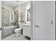 Bright bathroom with a glass-enclosed shower-tub and a floating sink vanity at 898 Oak Sw St # 1306, Atlanta, GA 30310