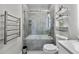 Clean bathroom featuring a shower-tub combo with glass doors and chrome fixtures at 898 Oak Sw St # 1306, Atlanta, GA 30310