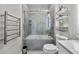 Well-lit bathroom with tiled shower/tub, modern fixtures, and shelving for toiletries at 898 Oak Sw St # 1306, Atlanta, GA 30310