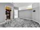 Spacious bedroom with a plush gray rug and walk-in closet with custom shelving at 898 Oak Sw St # 1306, Atlanta, GA 30310