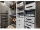 Walk-in closet features shelving, drawers and hanging racks for optimal organization at 898 Oak Sw St # 1306, Atlanta, GA 30310