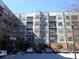 Multi-story apartment building with balconies and covered entry near parking spaces at 898 Oak Sw St # 1306, Atlanta, GA 30310