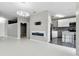 Spacious living room with a fireplace and a modern kitchen featuring a light countertop island with seating at 898 Oak Sw St # 1306, Atlanta, GA 30310