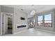 Bright, airy living room with fireplace and an adjacent room and balcony at 898 Oak Sw St # 1306, Atlanta, GA 30310