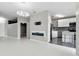 Open-concept living room featuring an electric fireplace and a view into the modern kitchen at 898 Oak Sw St # 1306, Atlanta, GA 30310