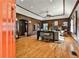 Living room featuring wood paneling, a stone fireplace, and hardwood floors at 1352 Emory Ne Rd, Atlanta, GA 30306