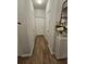 Hallway with clean finishes, including new paint, wood-look flooring, and updated decor at 1593 Maston Rd, Auburn, GA 30011