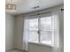 Bedroom featuring a ceiling fan, a window with curtains and neutral colors at 1952 Chapel Estates Ln, Dacula, GA 30019