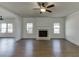 Spacious living room featuring a fireplace and a ceiling fan at 1952 Chapel Estates Ln, Dacula, GA 30019