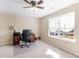 Bedroom with beige carpet, ceiling fan and window providing natural light at 4220 Lindsey Way, Conyers, GA 30013