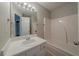 Neutral bathroom features a single sink vanity with a tub and shower at 6112 Shadow Rock Ln, Lithonia, GA 30058
