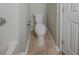 Bathroom featuring a toilet next to a doorway, with neutral flooring at 6112 Shadow Rock Ln, Lithonia, GA 30058