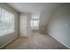 Carpeted bedroom with a small window and built in ledge at 6112 Shadow Rock Ln, Lithonia, GA 30058