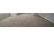 An ample room with beige carpet, grey paint and white trim at 6112 Shadow Rock Ln, Lithonia, GA 30058