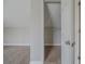 Bedroom view into closet with carpeted floor and wire shelving at 6112 Shadow Rock Ln, Lithonia, GA 30058