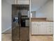 A large stainless steel refrigerator, ample counter space and white cabinets at 6112 Shadow Rock Ln, Lithonia, GA 30058
